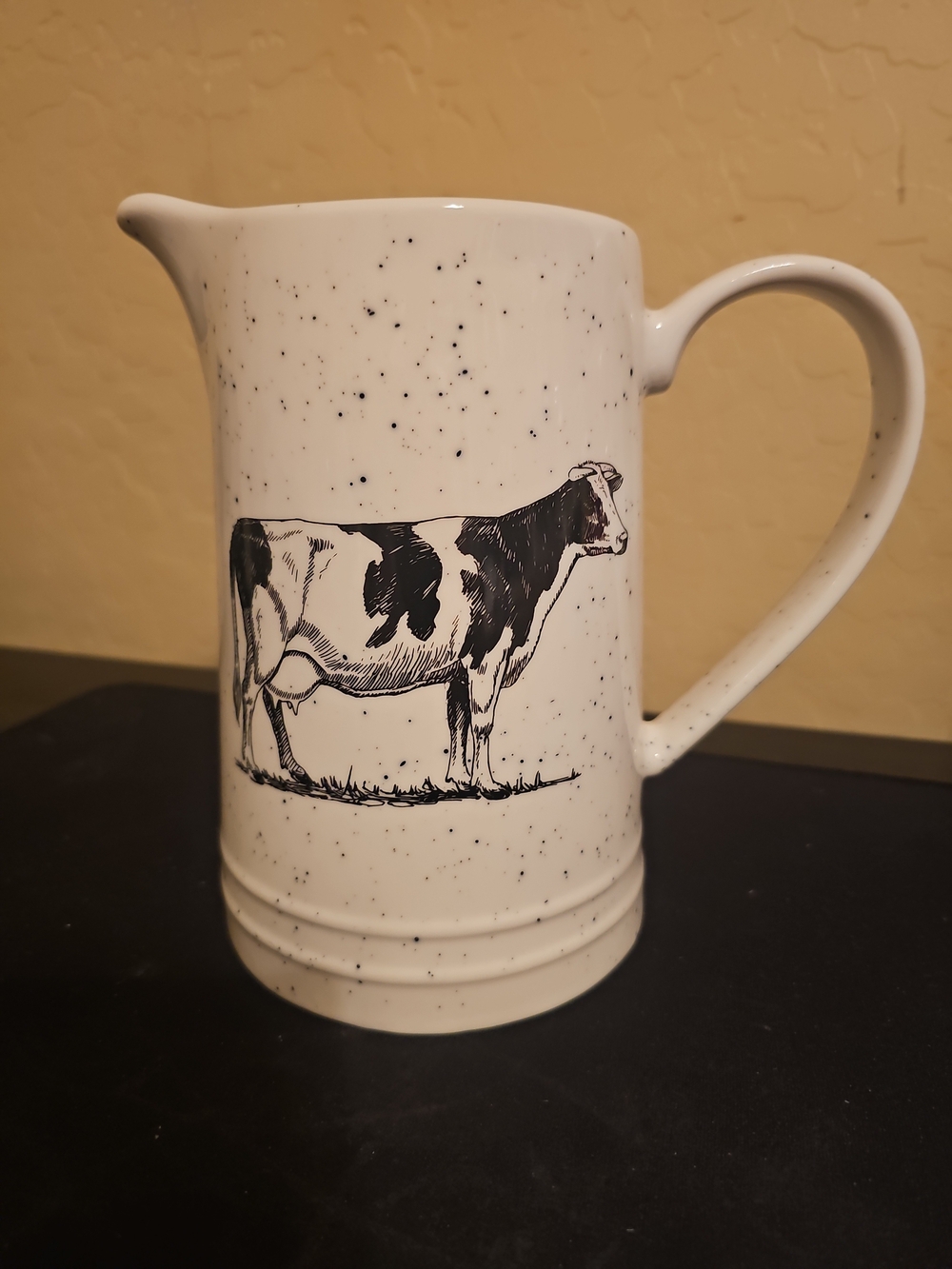 Grace White Speckled Ceramic Pitcher with Black Cow Illustration